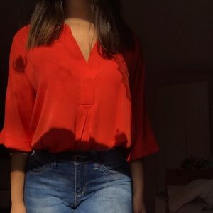 orange flowy top